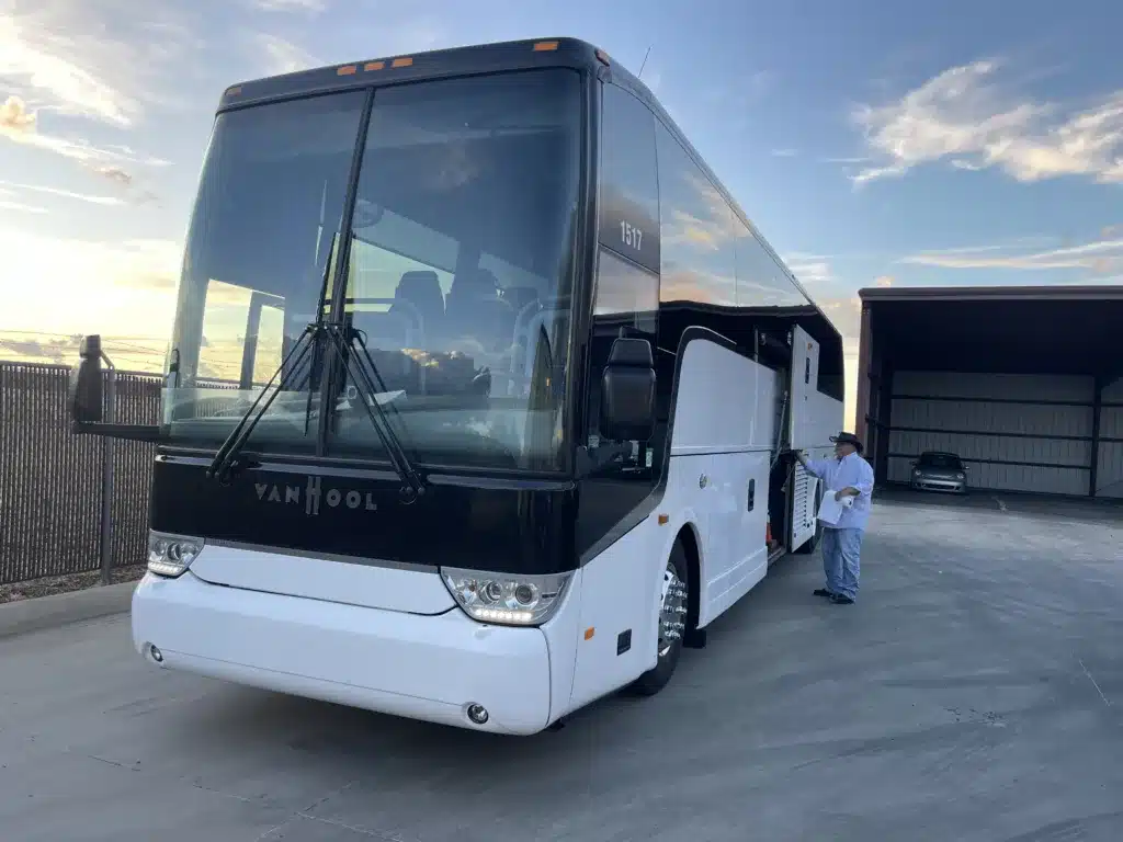 Driver with charter bus rental Divine Charter bus rentals