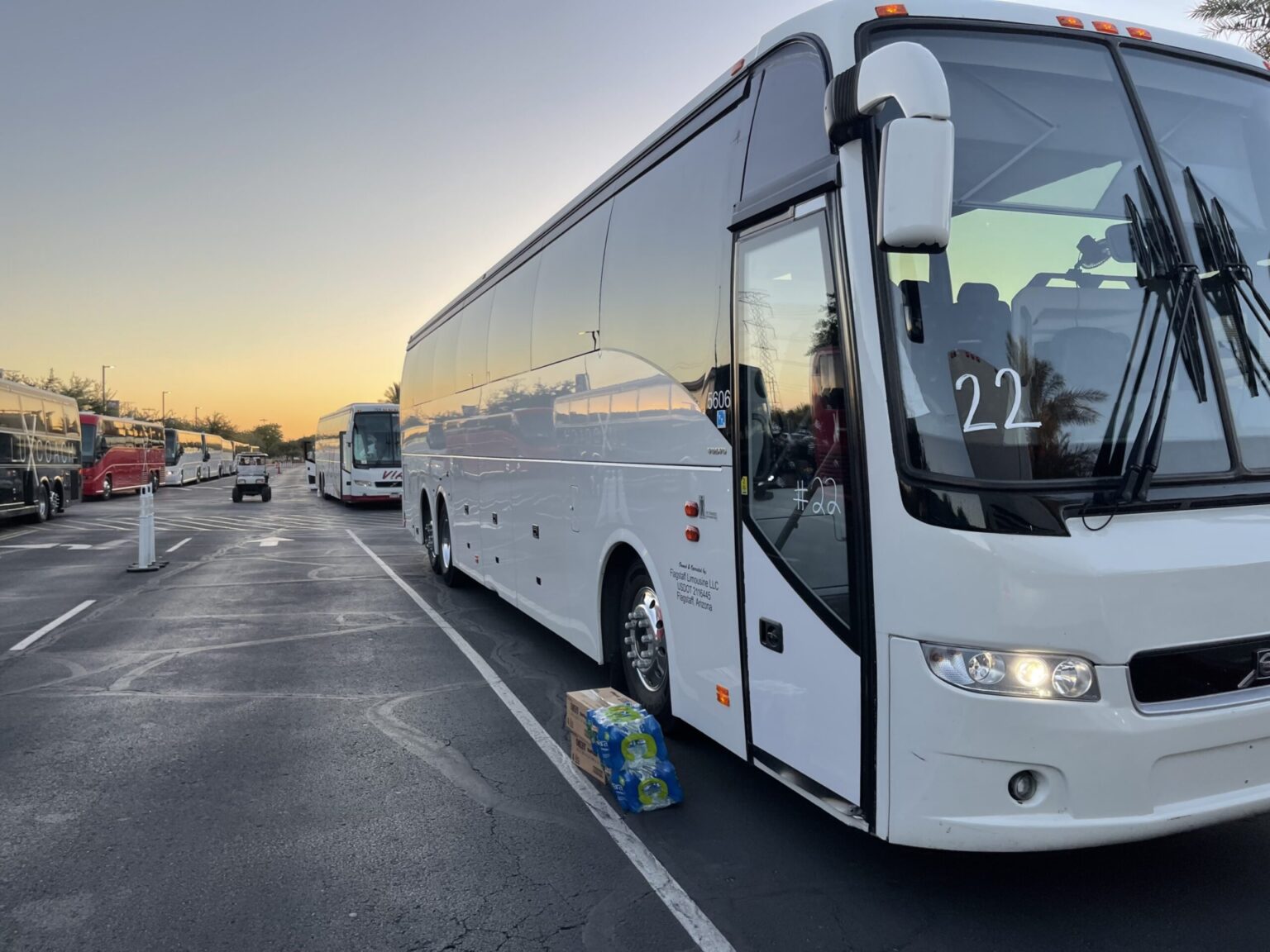 a white charter bus ready for rent